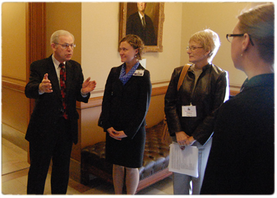 Justice David T. Prosser discusses the work of the Supreme Court during the Legislative Council’s orientation program for new legislators with Legislative Council Staff Atty. Anna Henning and Rep. Debra Kolste, D-Janesville, as Legislative Council Staff Atty. Jessica Ozalp looks on.
