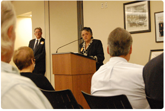 Chief Justice Shirley S. Abrahamson speaks at the Dane County juror appreciation celebration, as Chief Judge C. William Foust looks on.