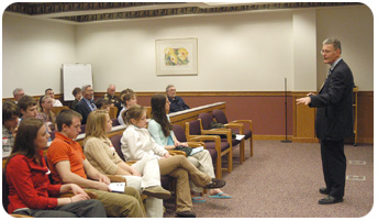 Dodge County Circuit Court Chief Judge John R. Storck discusses a day in the life of the court with high school students from Lomira, Dodgeland, Hustisford, Horicon, Beaver Dam and Mayville during the 51st annual Student Government Day program in Juneau. (Photo by Diane Graff, Watertown Daily Times) 