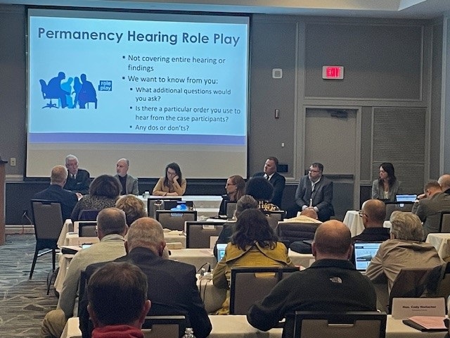 Permanency Plan Role Play- panel members from left to right:  Retired Judge Christopher Foley, Judge Todd Ziegler, Judge Wendy Klicko, Judge Jason Rossell, Commissioner Anton Jamieson, and Attorney Christina Tenuta
